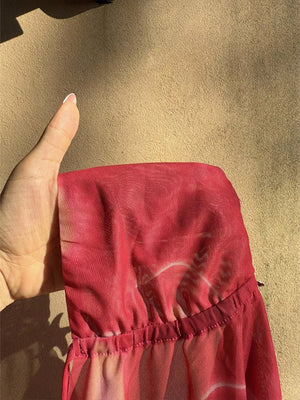 Backless halter neck cami in sheer red abstract print mesh with ruched elastic hem.
