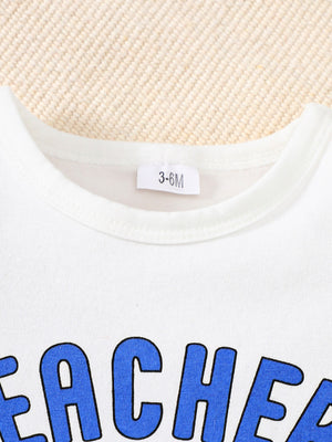White baby tee with blue "Teacher" graphic and size tag