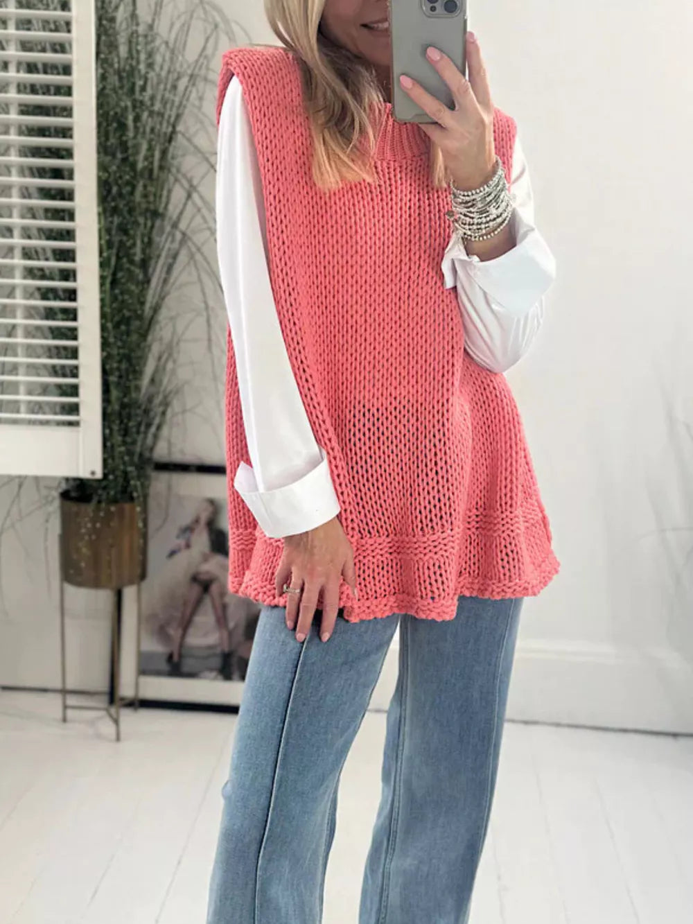 100% acrylic Care instructions: Machine wash cold sweater vest in coral pink with relaxed silhouette