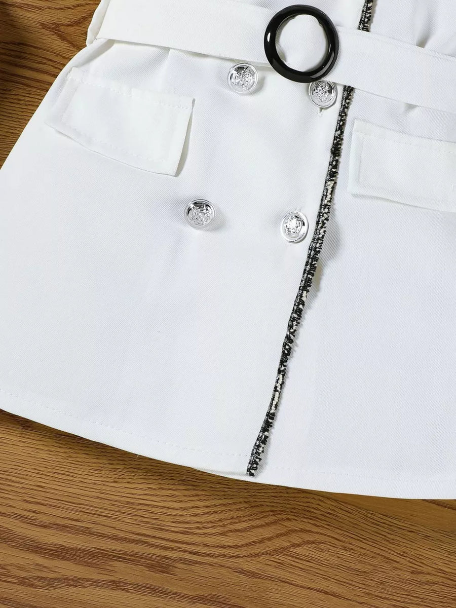 White toddler dress with double-breasted buttons, black ring belt, and decorative trim.