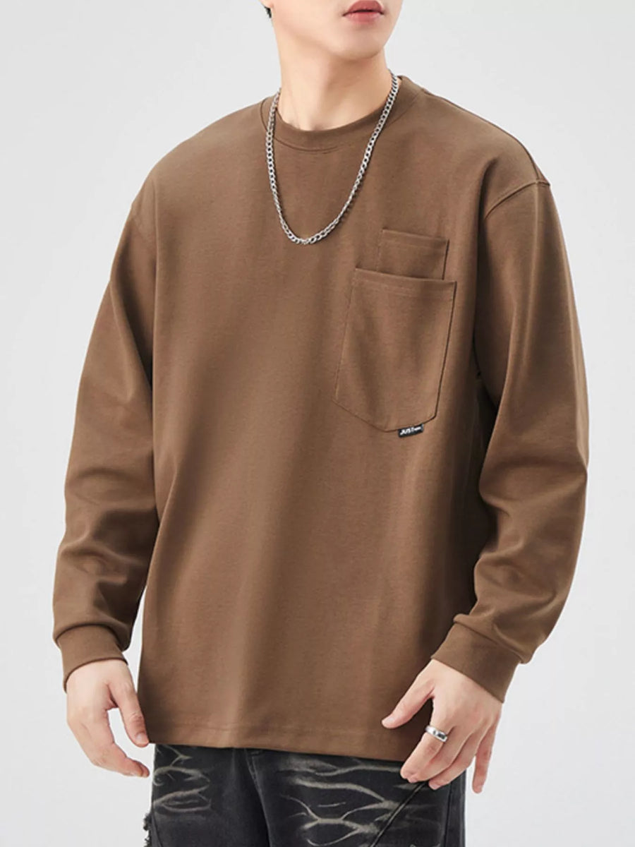 Brown long-sleeve sweatshirt with chest pocket and crew neck.