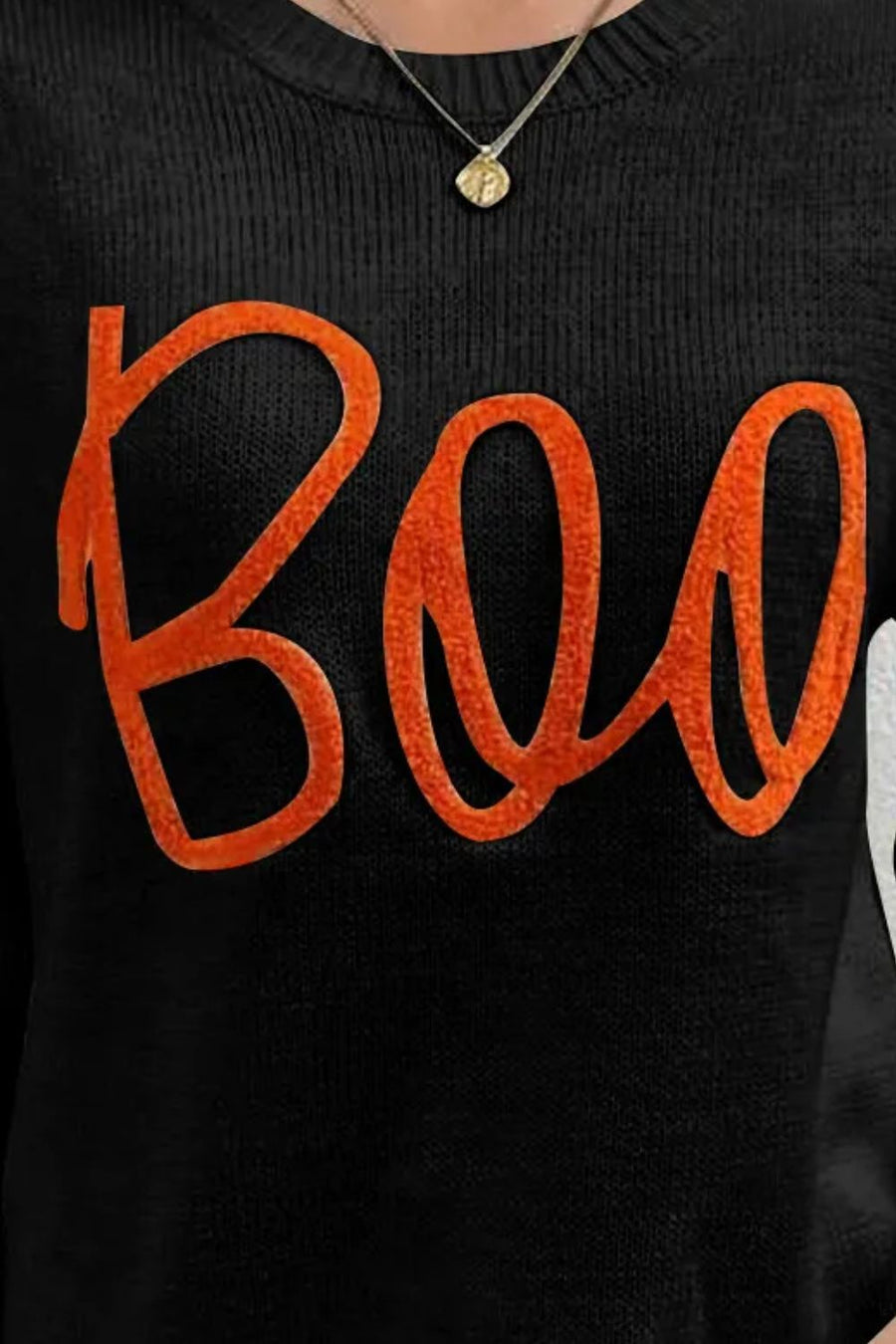 Black crewneck sweater with orange "Boo" appliqué detail