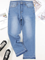 Whiskered wash cropped jeans in light blue denim with frayed hem detail.