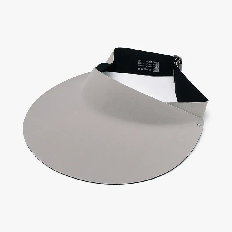 Sculptural visor sun shield in light gray with adjustable black band.