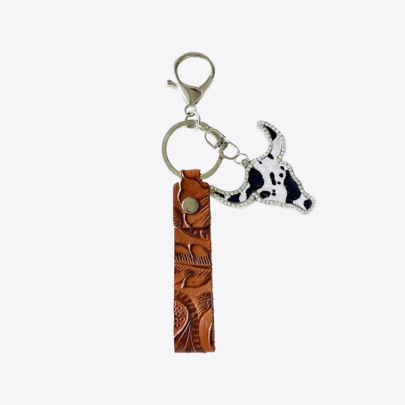 Western keychain with embossed leather strap and cow skull charm with crystal accents