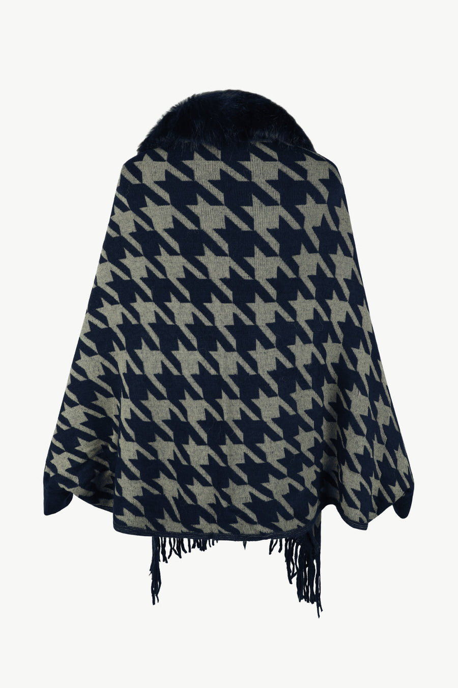 Houndstooth poncho with faux fur collar and fringe trim in dark blue and beige.