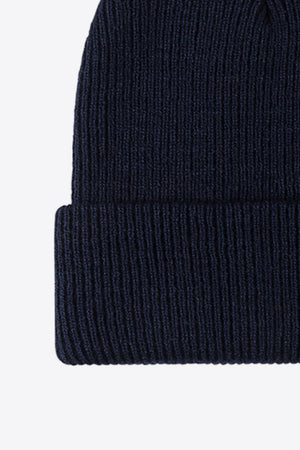 Navy ribbed knit beanie with a cuffed hem
