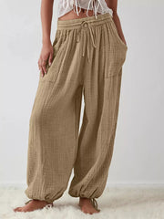 wide-leg pants in khaki featuring drawstring waist and loose fit