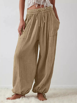 wide-leg pants in khaki featuring drawstring waist and loose fit