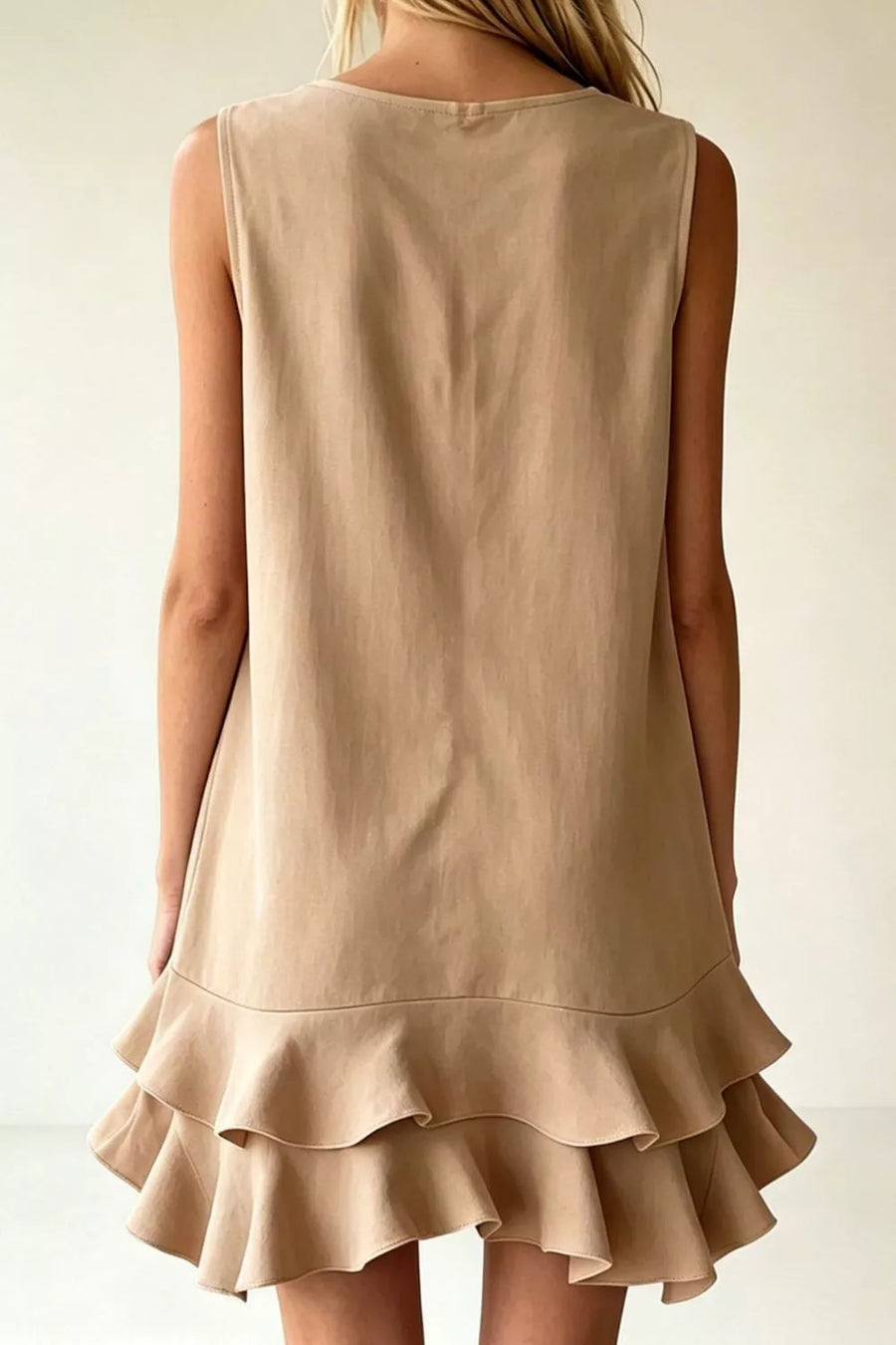 Taupe mini dress with V-neck, sleeveless, and tiered ruffle hem.
