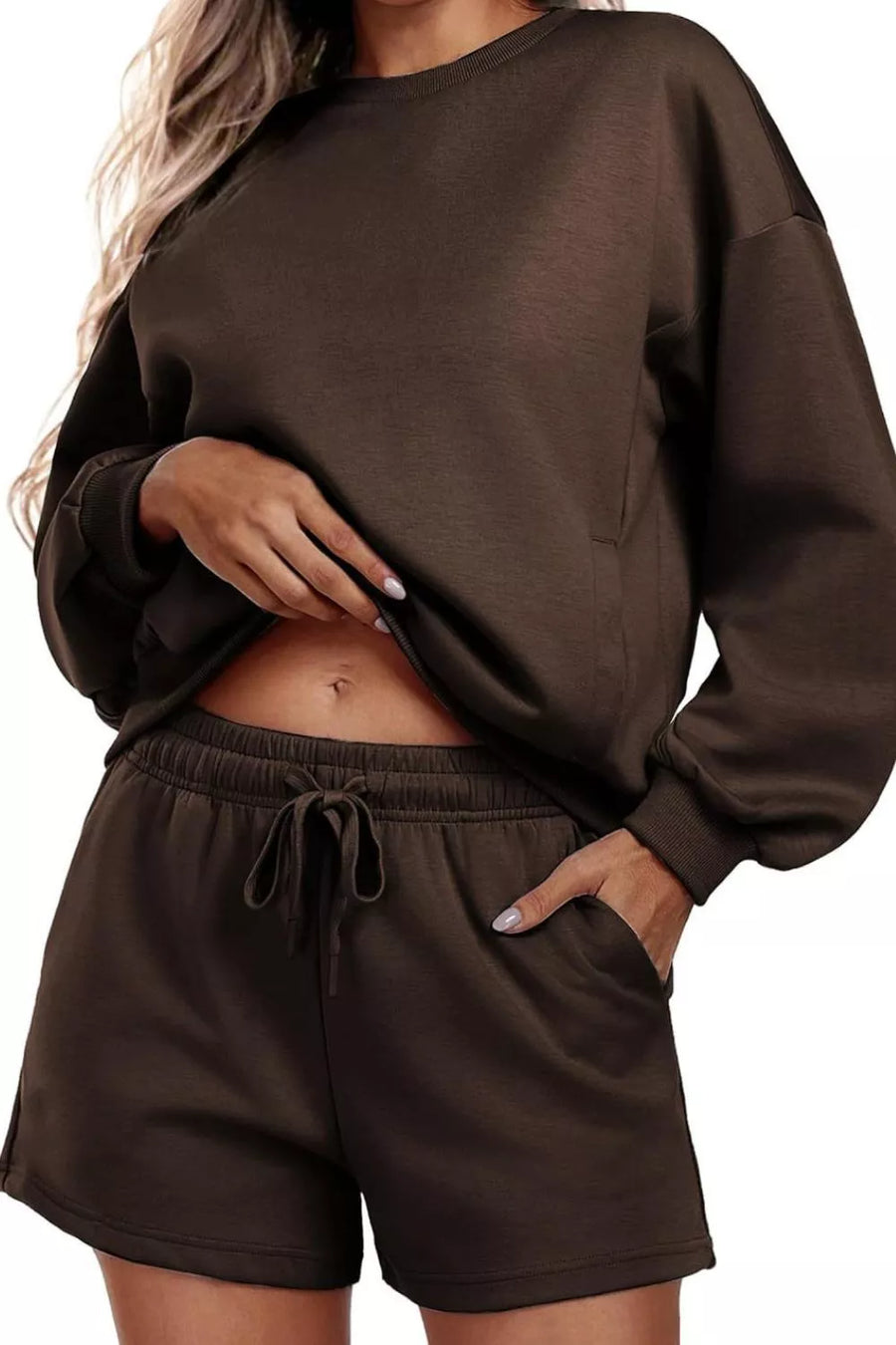 Cozy two-piece loungewear set in dark brown with drawstring shorts and crewneck sweatshirt.