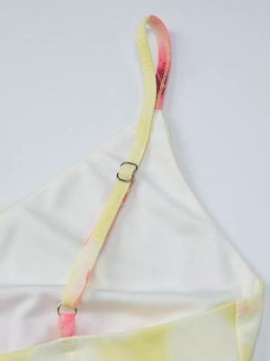 Floral asymmetrical mini dress with ruffled hem, yellow and pink tie-dye print, cotton.