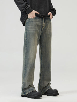 Vintage blue wide-leg denim jeans with a relaxed fit and distressed wash.