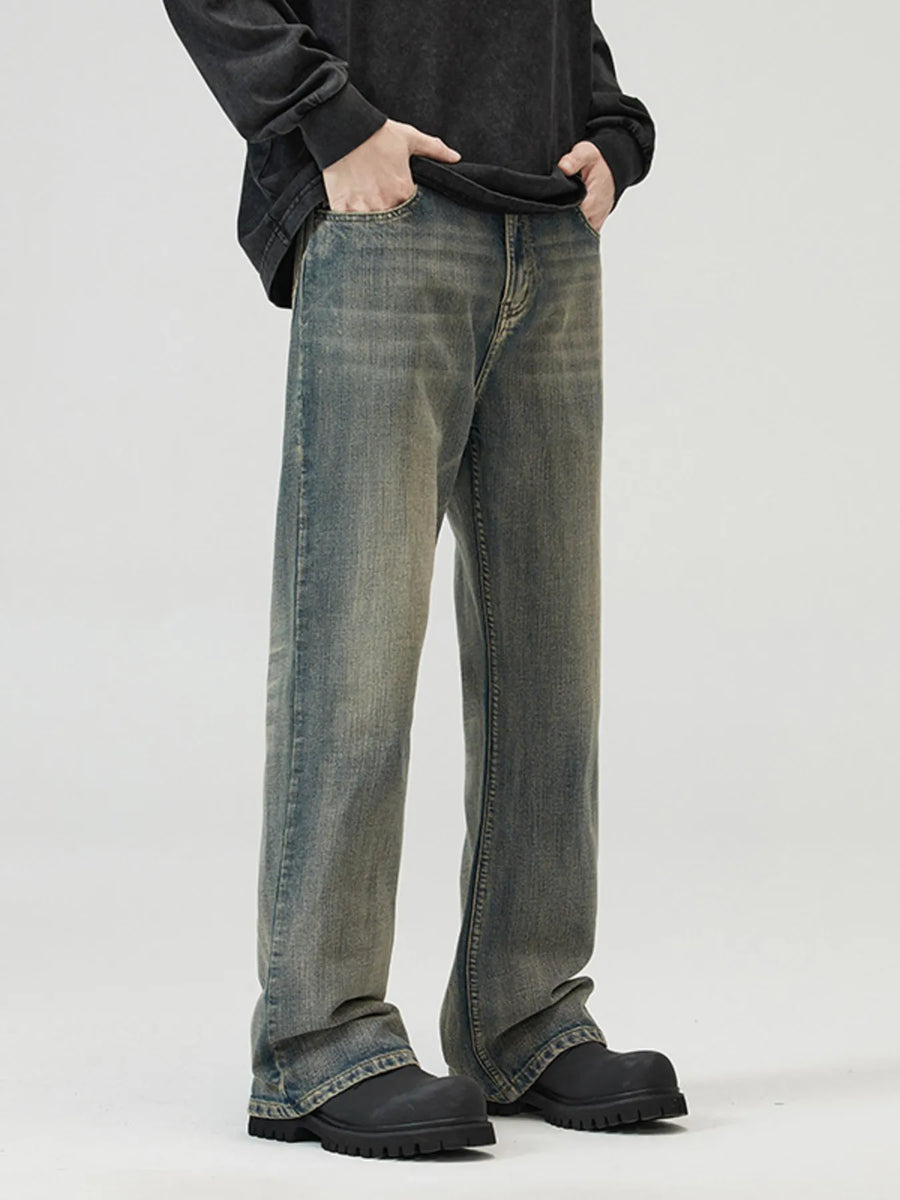 Vintage blue wide-leg denim jeans with a relaxed fit and distressed wash.