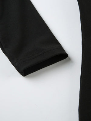 Black long-sleeve active romper with a clean hem detail on the sleeve cuff.