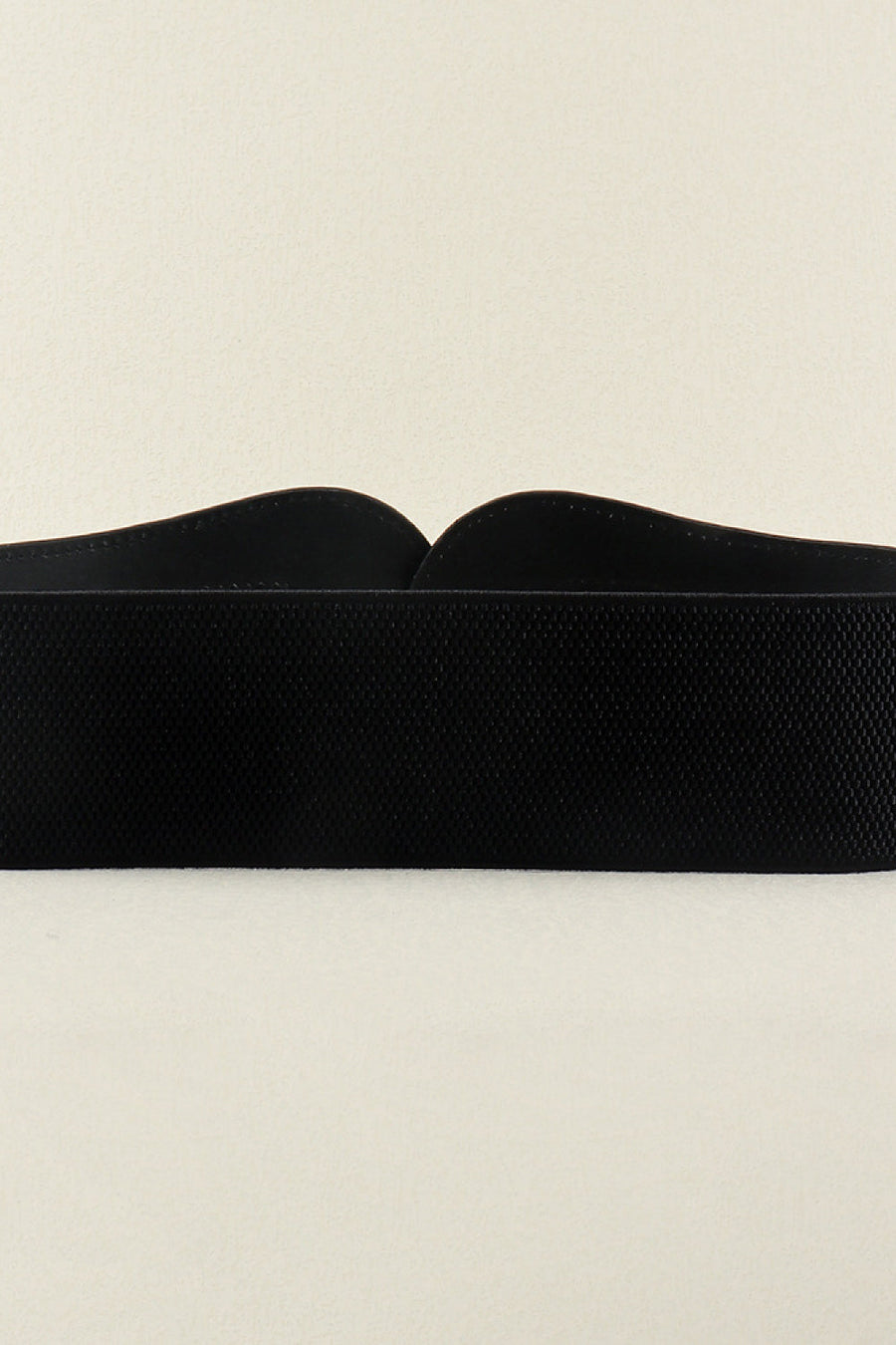 Black elasticated corset belt with textured fabric and sculpted buckle detail