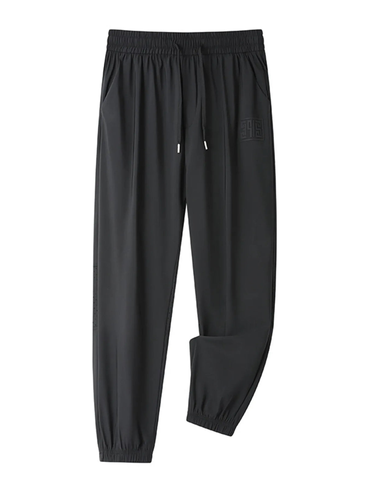 Black drawstring joggers with elastic cuffs and a subtle embossed logo detail.
