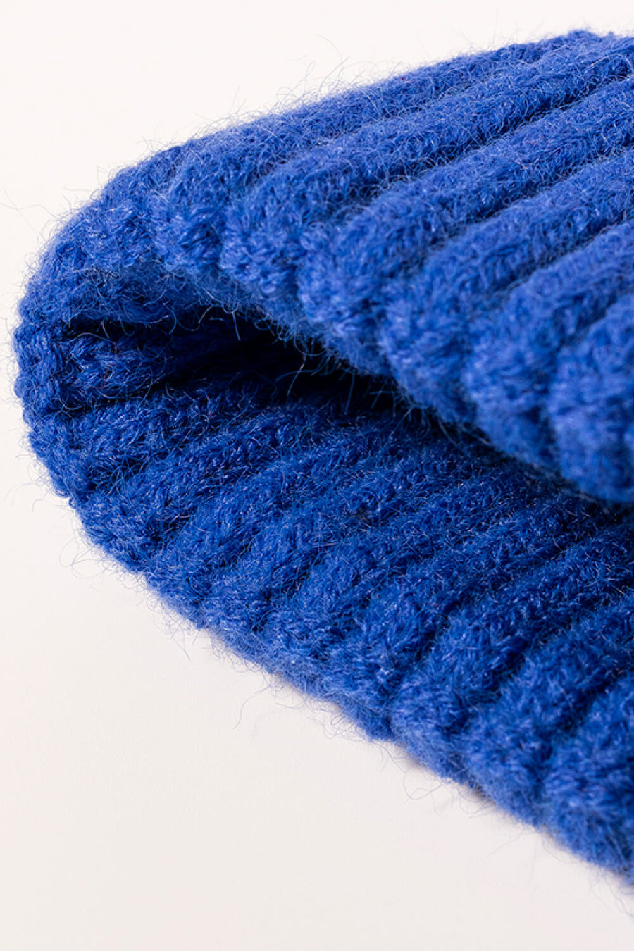 Blue chunky ribbed knit beanie with fuzzy acrylic texture