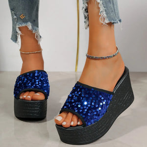 Navy sequin platform wedge slides with black sole and trim.