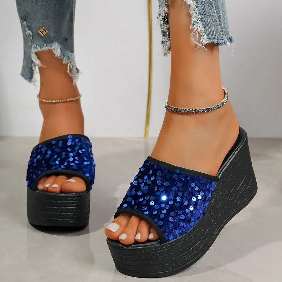 Navy sequin platform wedge slides with black sole and trim.