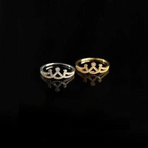 Silver and gold pave crown motif rings with clear stones