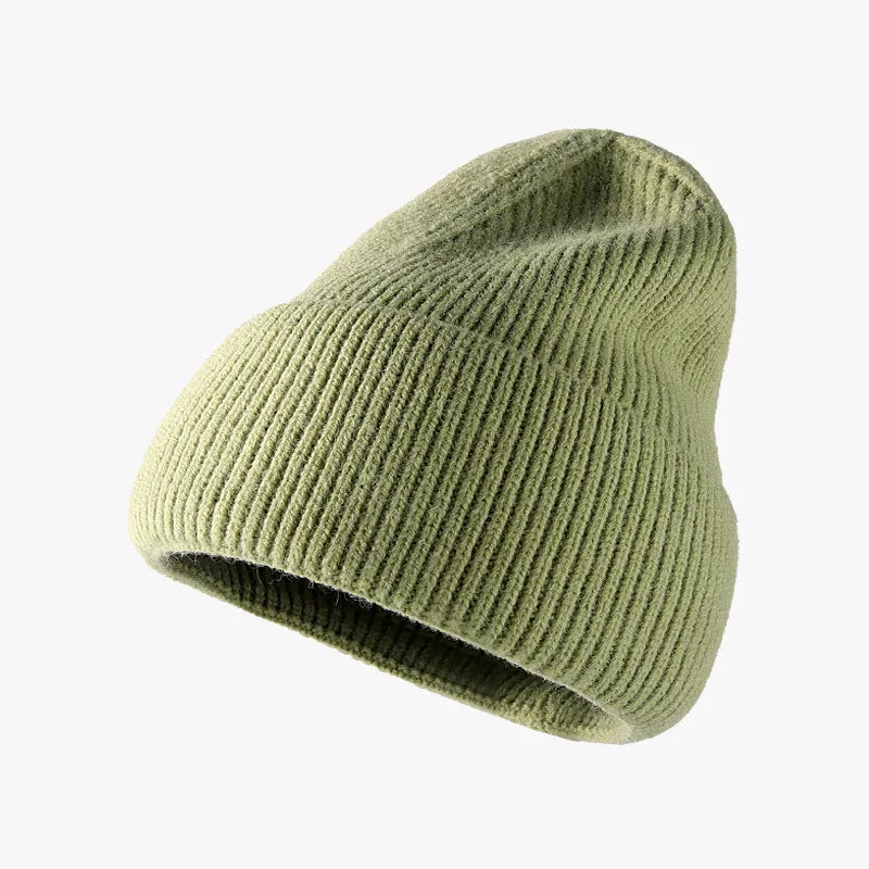 Ribbed knit slouch beanie in Matcha Green with a relaxed fit.