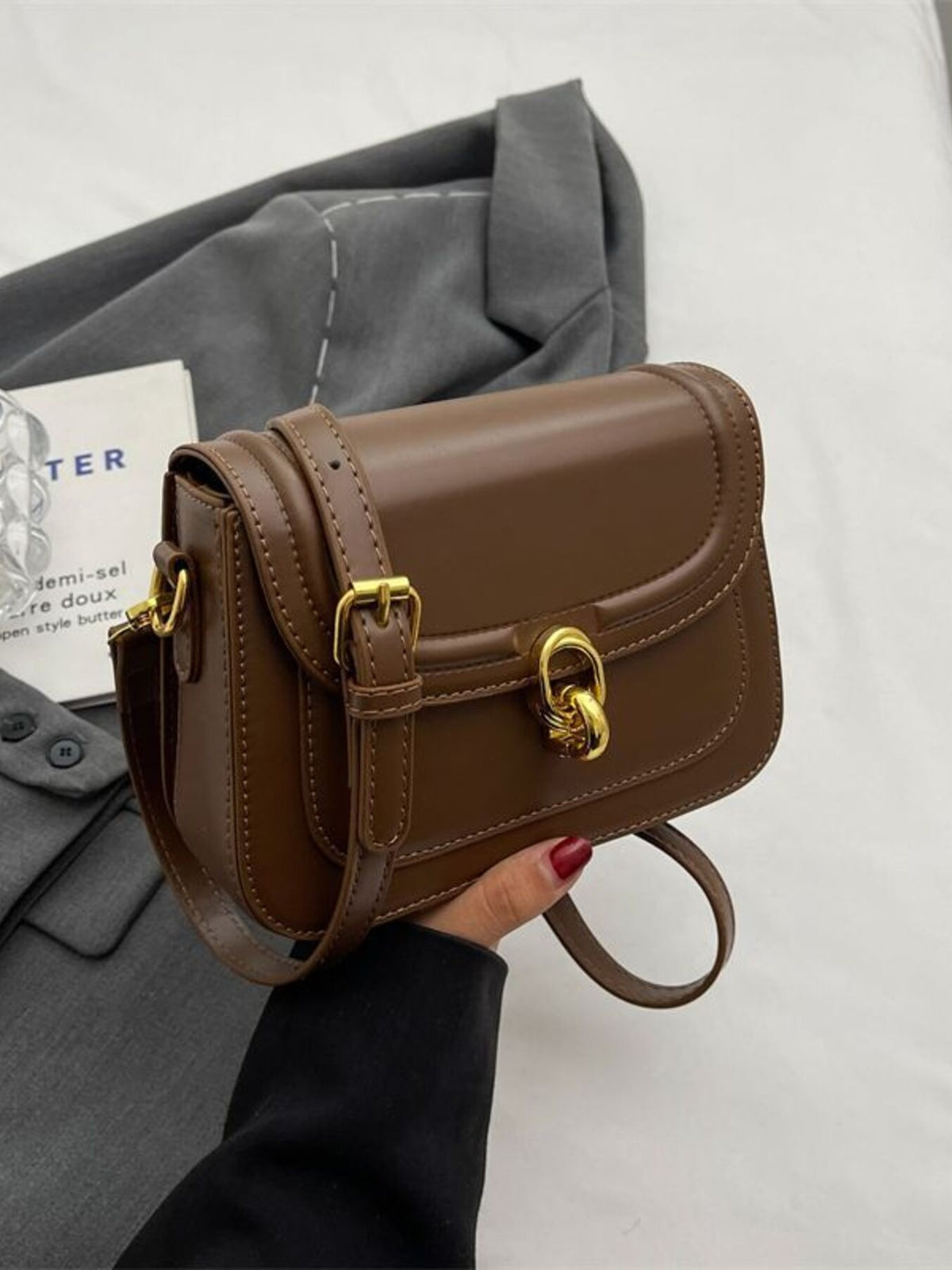 Premium Pu leather flap crossbody bag in coffee color with gold hardware and adjustable strap.