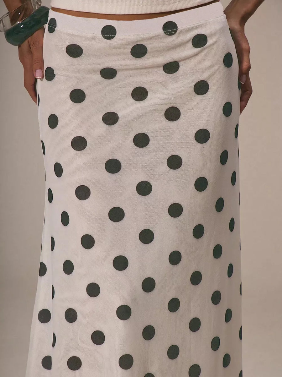 Classic polka dot midi skirt in sheer white fabric with dark grey dots.