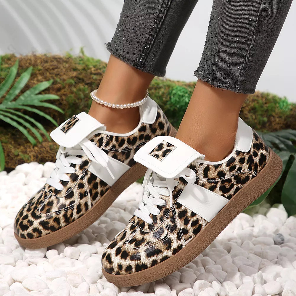 white sneakers featuring round toe and leopard-print