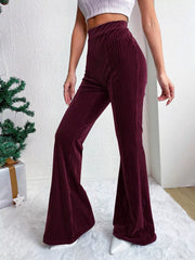 Burgundy corduroy high-waist flare maternity pants with bell bottoms.
