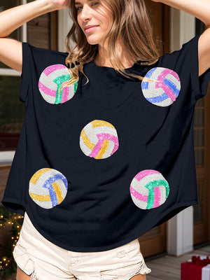 Navy t-shirt with sequin volleyball graphics in pink, blue, yellow, and green.