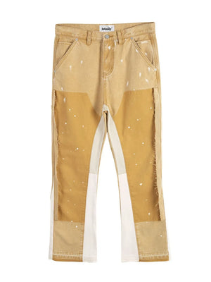 Split panel bootcut jeans in coffee brown with paint splatters and raw hem details.