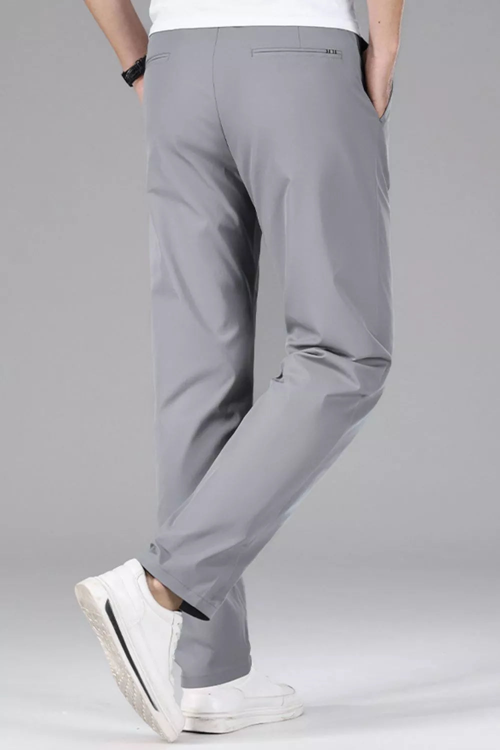 Men's gray slim-fit stretch dress pants with a clean, modern cut.