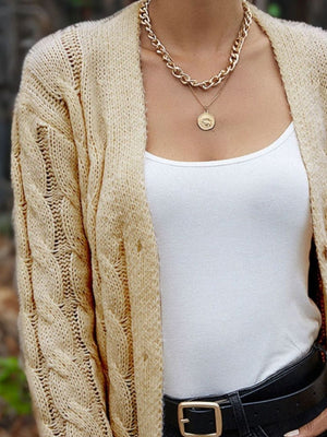 Cable knit sleeve cardigan in Chestnut, open front, with a white tank top and gold necklace.