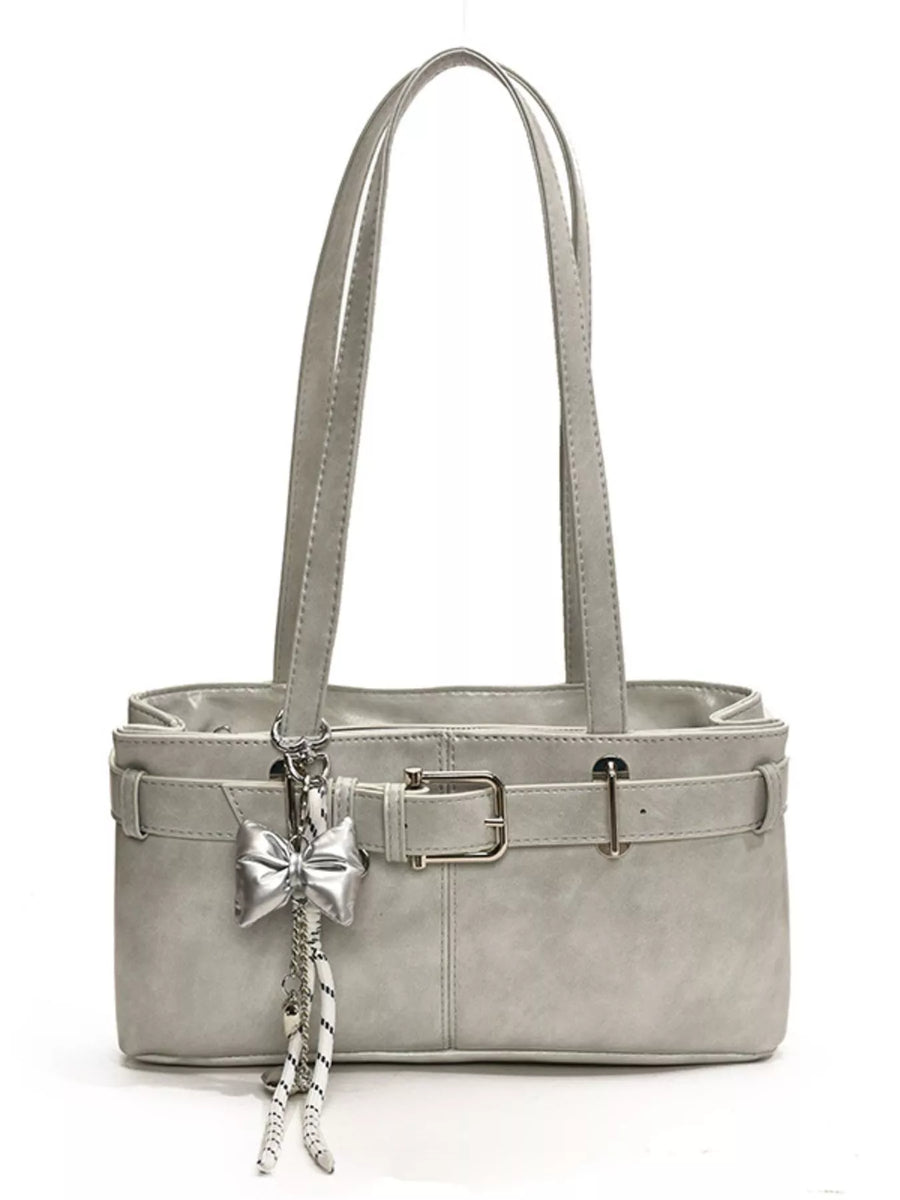 Gray shoulder bag with buckle detail and bow charm