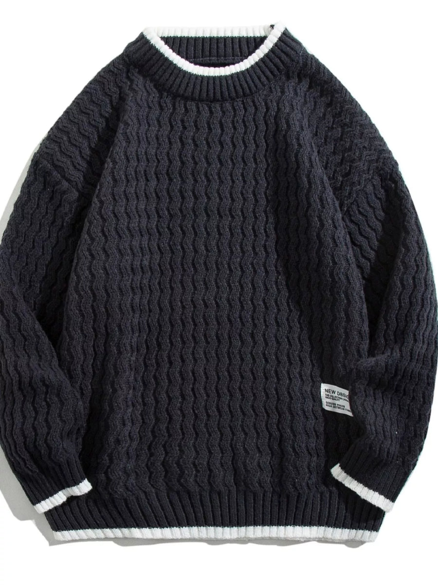 Men's black textured knit sweater with white striped collar and cuffs.