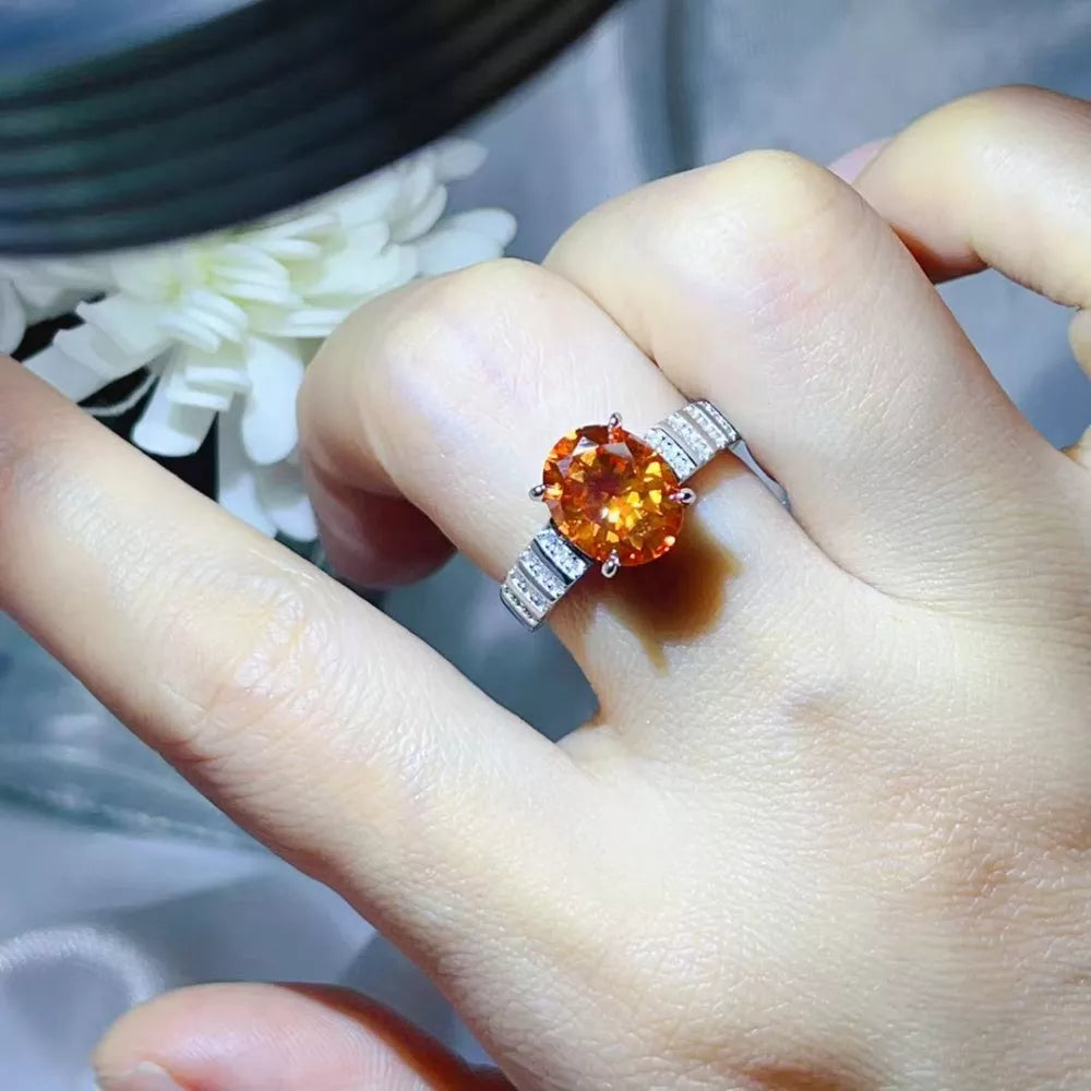 ring in orange featuring oval cut moissanite and fitted fit