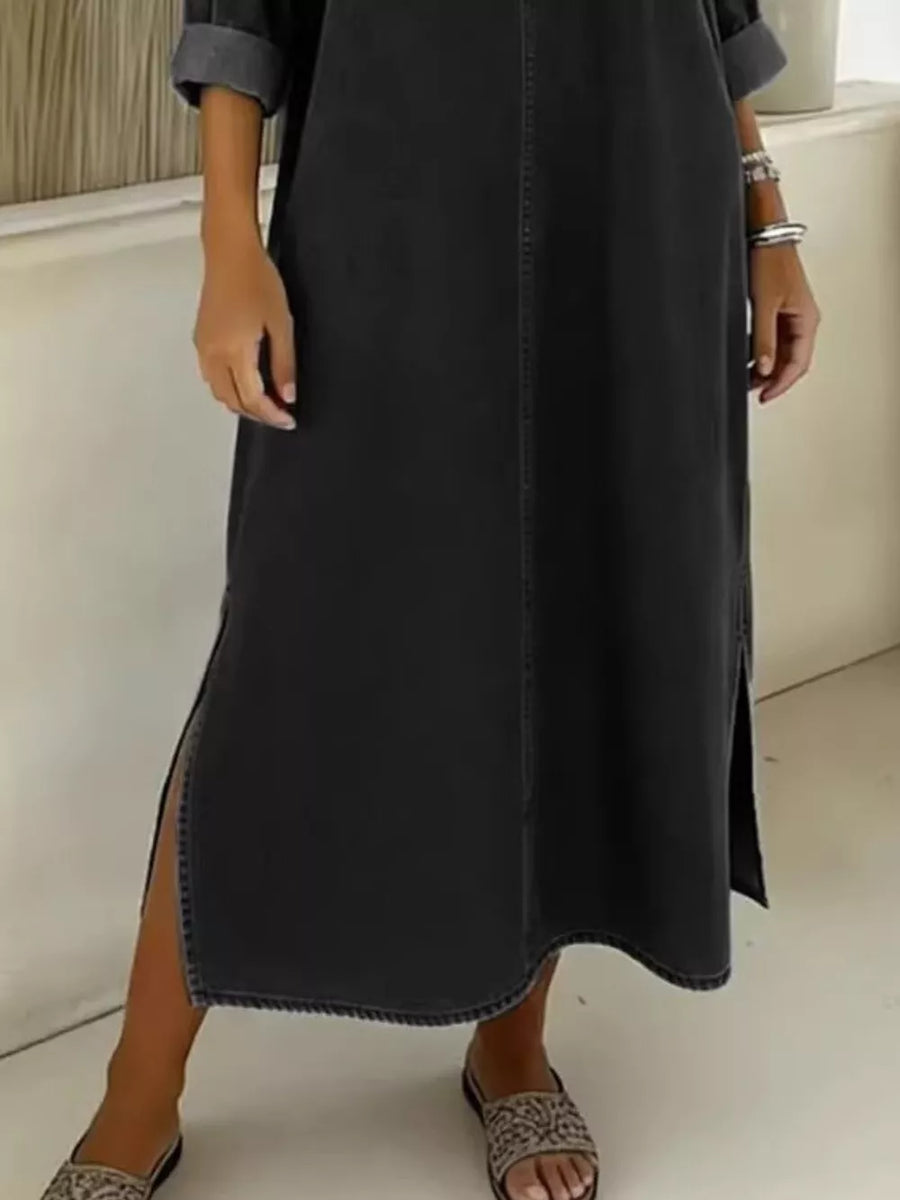 Black midi dress with V-neck, short sleeves, and side slits.