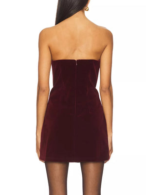 Wine red velvet mini dress with strapless neckline and back zipper detail.