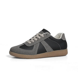 Retro panel leather sneakers in black and grey suede with a gum sole.