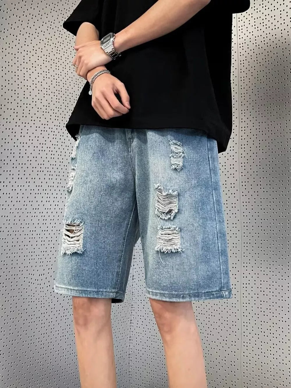 Men's distressed wash wide leg denim shorts with ripped details