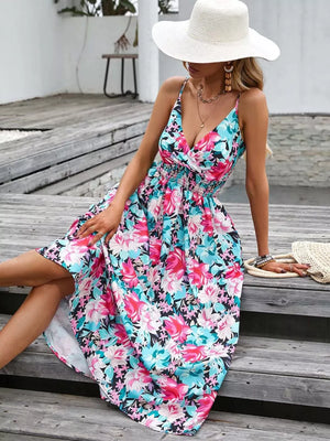 Floral print midi dress with smocked waist and V-neckline.