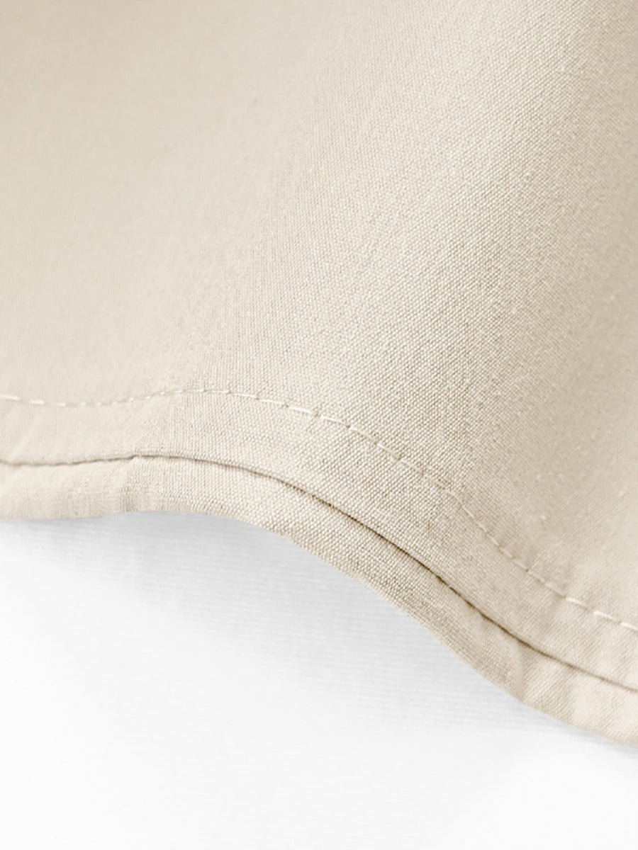Beige cuffed hemline wide-leg trousers detail showing double stitching and fabric texture.
