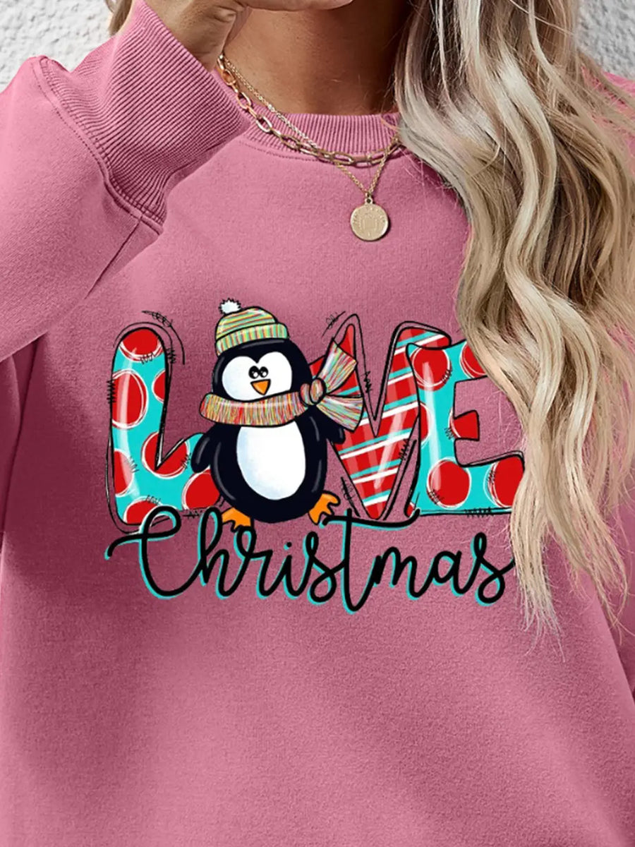 Blush Pink sweatshirt with festive penguin graphic and Christmas text.