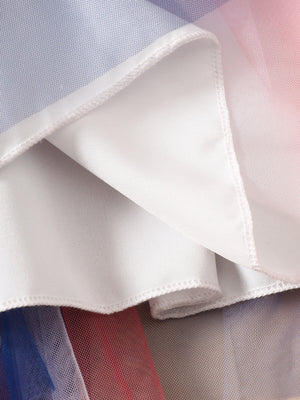 Patriotic star-spangled tulle dress with blue, white, and red layers and white lining.