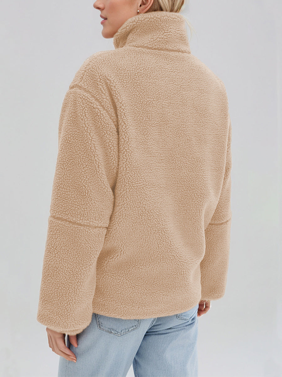 Tan sherpa stand-collar jacket with a textured fleece finish and casual fit.