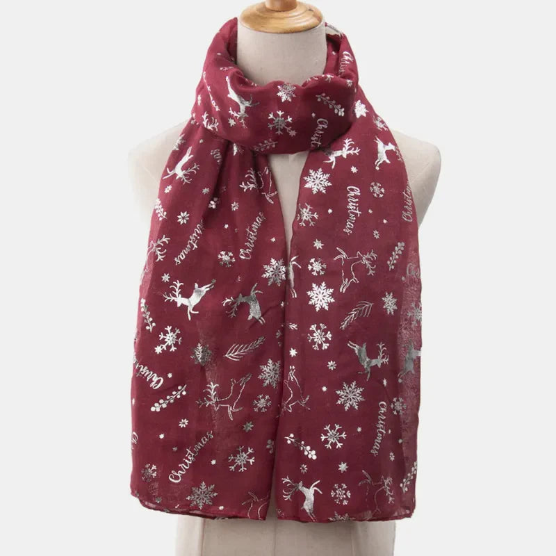 Burgundy Christmas print metallic scarf with reindeer and snowflakes.
