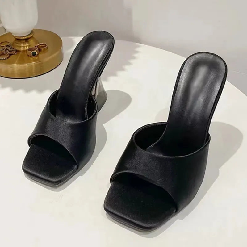 Black satin mules with square toe and sculpted heel