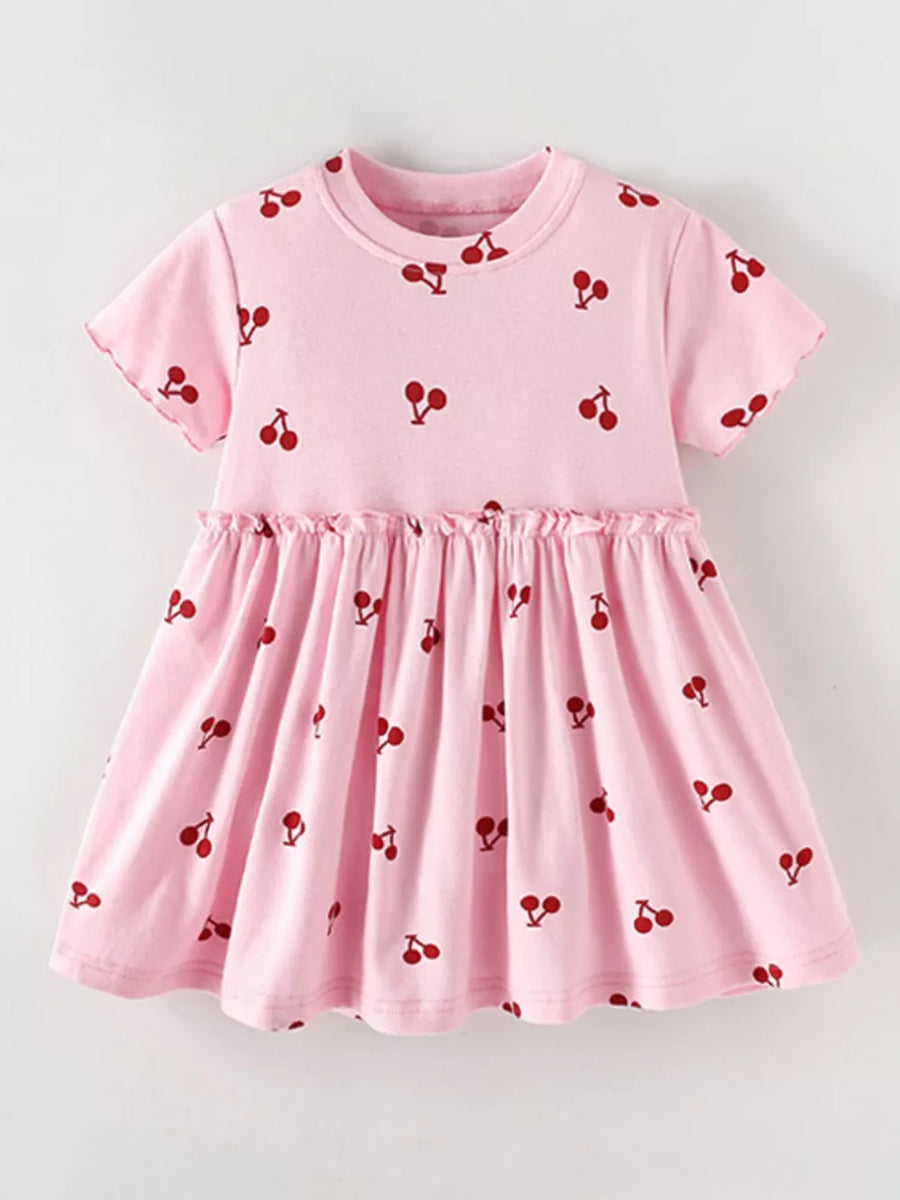 Baby dress in blush pink with a red cherry print, short sleeves, and ruffled waist.