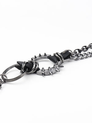 Black spiked chain harness belt with metal ring detail and aluminum spikes.